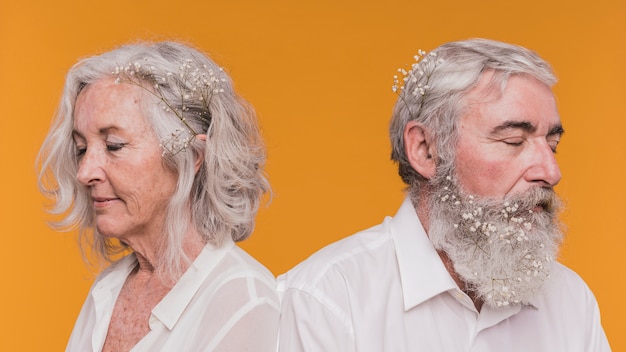 A side-by-side comparison of three different people using the reverse aging filter. Each pair of images shows the individual's original photo next to the digitally aged version, highlighting the differences in skin texture, wrinkles, and hair color.