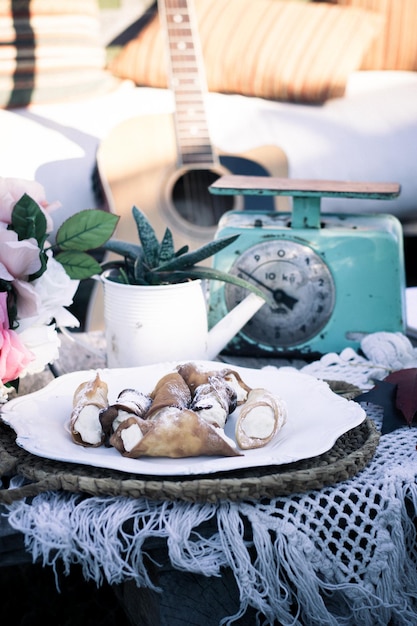 A collage of images showcasing the Coastal Grandmother aesthetic. The images feature women in linen clothing, beach houses decorated in neutral tones, and scenes of gardening and cooking.