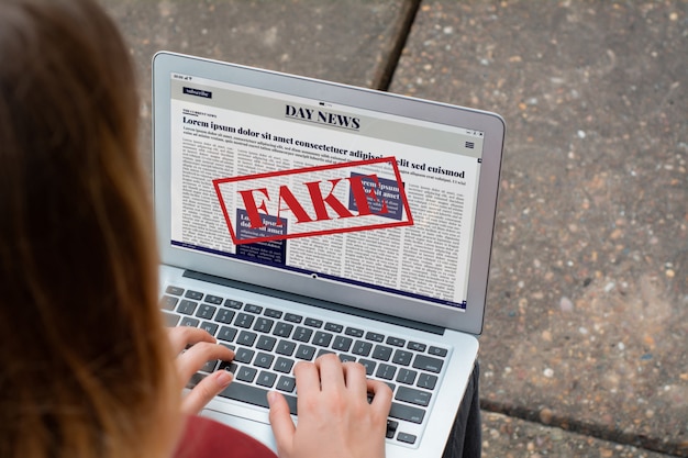 A screenshot of a popular social media platform with a highlighted fake news article being shared widely. The comments section shows a mix of people believing and questioning the article's authenticity. The image is intended to illustrate how easily misinformation can spread on social media.