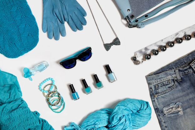 A collage of various capsule wardrobe outfits, each featuring different combinations of the essential pieces. The outfits range from casual to professional to evening wear, demonstrating the versatility of the curated wardrobe. Each outfit is styled with minimalist accessories.