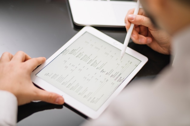 Close-up shot of a digital tablet displaying the FTC's updated guidelines for sweepstakes, with annotations and highlights emphasizing the key changes. The background is blurred to keep the focus on the tablet screen.