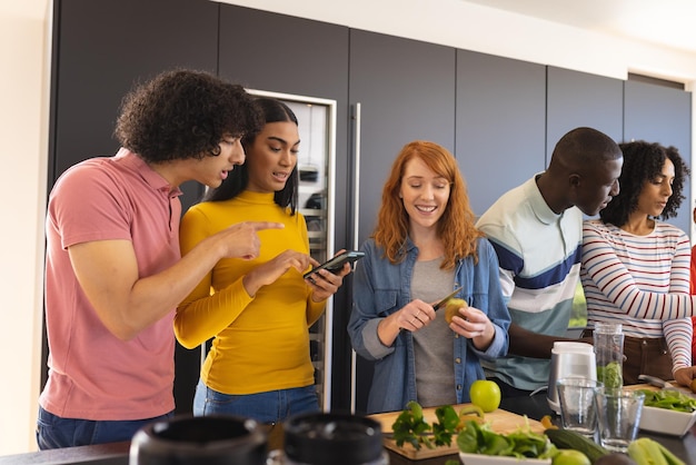 A close-up shot of a diverse group of people using various products (smartphones, tablets, kitchen gadgets) while smiling and gesturing positively, representing user testing feedback in action.