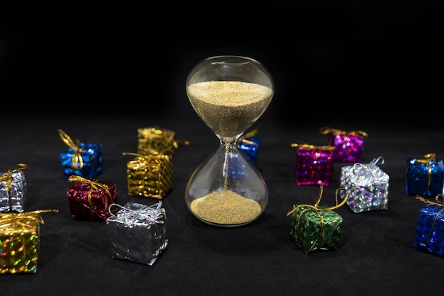 A graphic illustrating a giant hourglass running out of sand over a pile of gift cards. Each grain of sand is a denomination of currency. The scene is vibrant and slightly whimsical, meant to symbolize the fleeting value of unredeemed gift cards.