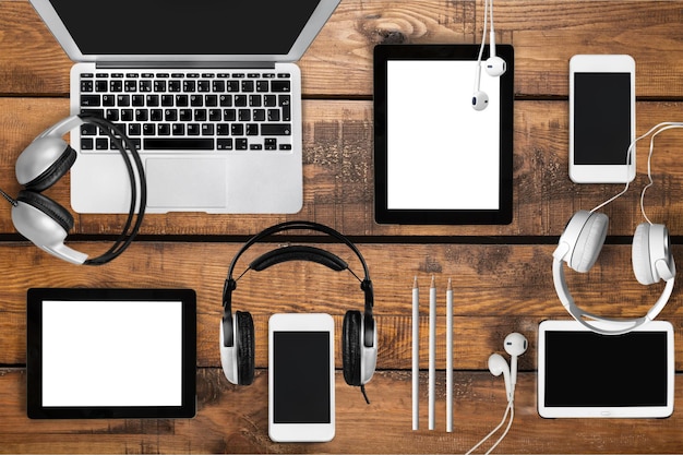 A split-screen image showcasing various electronic devices such as smartphones, laptops, headphones, and smartwatches, all with price tags indicating significant discounts. Each device is set against a blurred background of Amazon's product pages.