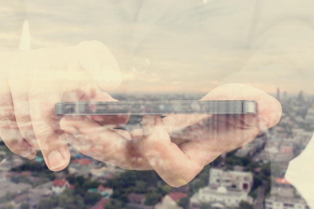 A close-up of a person's hand hovering over a smartphone, with blurred and distorted news headlines in the background, emphasizing the challenge of discerning truth in the digital age.